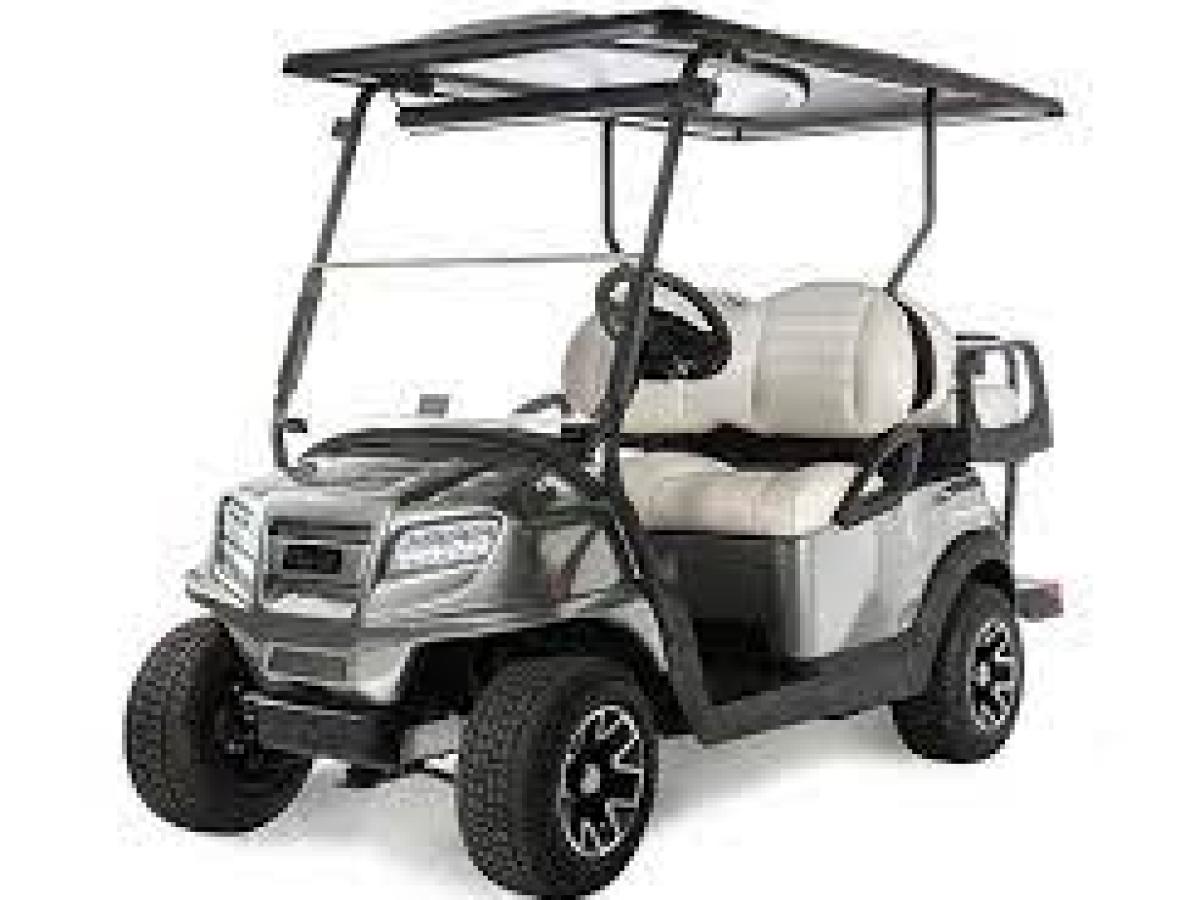 a truck cake sitting on top of a car