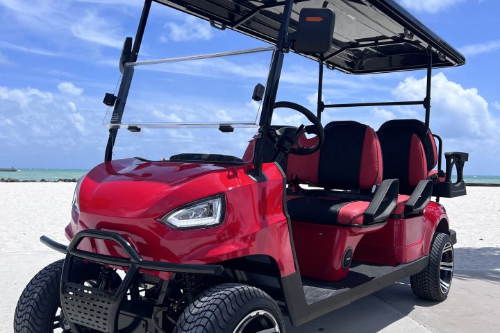 a golf cart parked on the side of a road